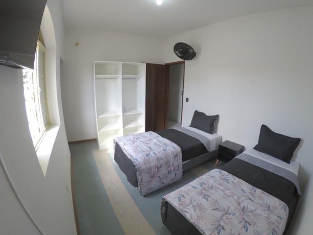 Imagen de la habitación del Hotel Quartos Delfim Moreira. Foto 7