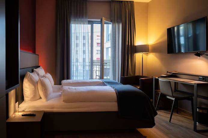 Imagen de la habitación del Hotel Qube Bahnstadt. Foto 18