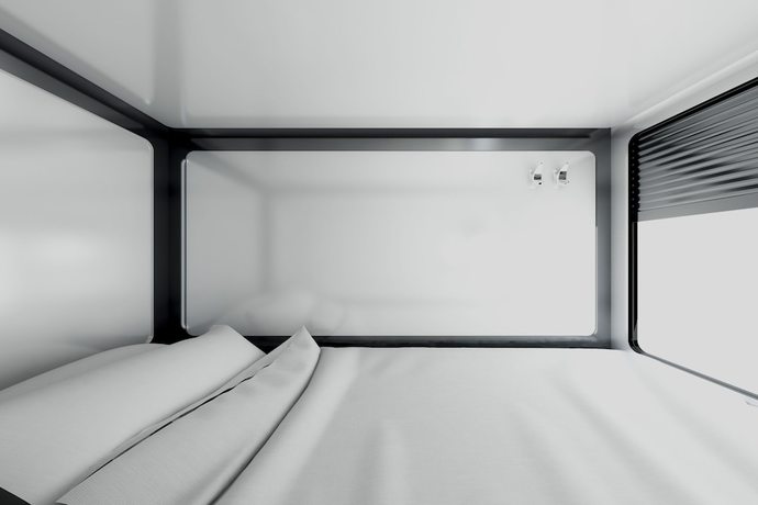 Imagen de la habitación del Hotel Qube Capsules. Foto 8