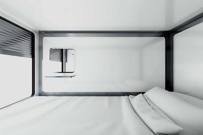 Imagen de la habitación del Hotel Qube Capsules. Foto 11