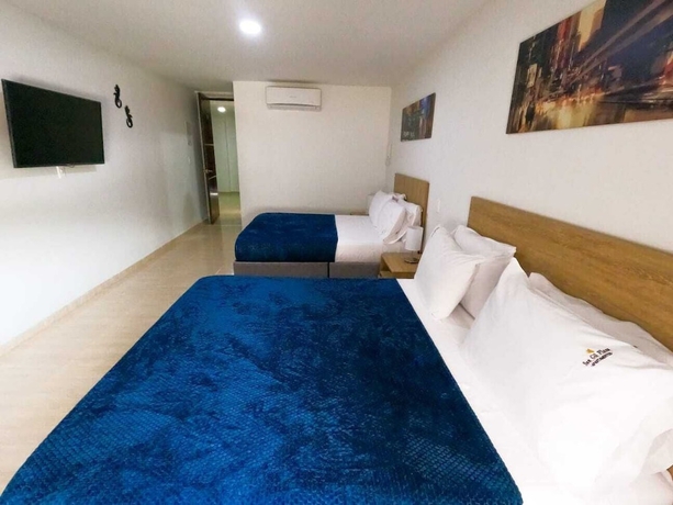 Imagen de la habitación del Hotel Quedate Apartahotel San Gil Plaza. Foto 4