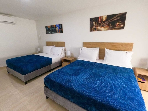 Imagen de la habitación del Hotel Quedate Apartahotel San Gil Plaza. Foto 7