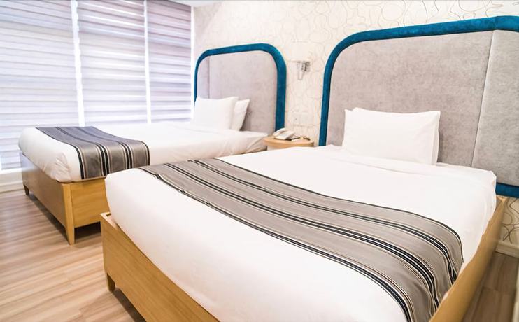 Imagen de la habitación del Hotel Queen Margarette Hotel - Downtown. Foto 4