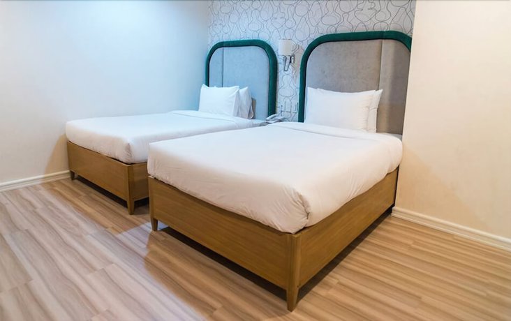 Imagen de la habitación del Hotel Queen Margarette Hotel - Downtown. Foto 6