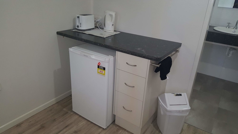 Imagen de la habitación del Hotel Queens Beach Motor. Foto 11