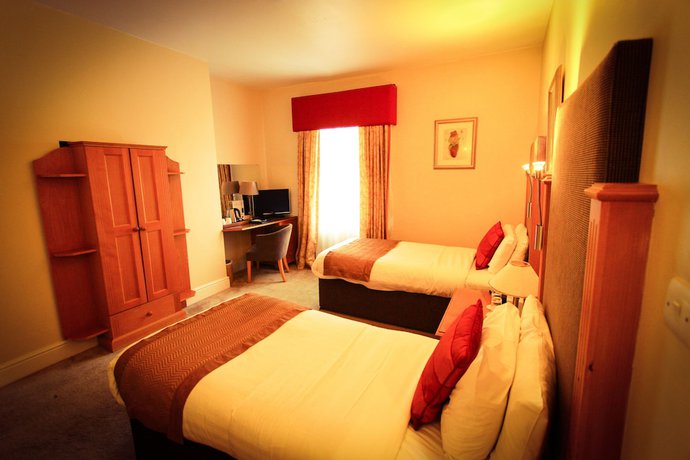 Imagen de la habitación del Hotel Queens Court. Foto 11