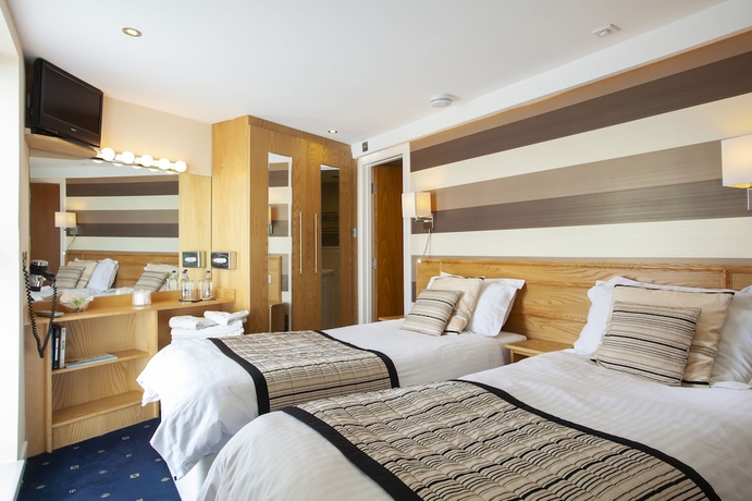 Imagen de la habitación del Hotel Queens Mansions. Foto 8