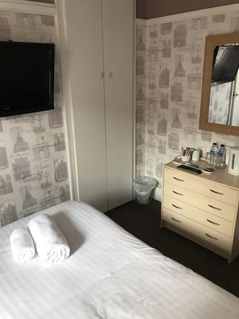 Imagen de la habitación del Hotel Queens Plaza. Foto 10
