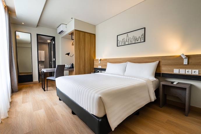 Imagen de la habitación del Hotel Quest Hotel Prime Pemuda - Semarang. Foto 8
