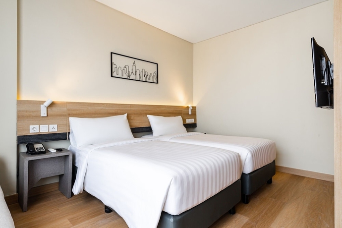 Imagen de la habitación del Hotel Quest Hotel Prime Pemuda - Semarang. Foto 10