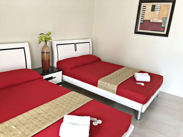 Imagen de la habitación del Hotel Quezon Premier Candelaria. Foto 2