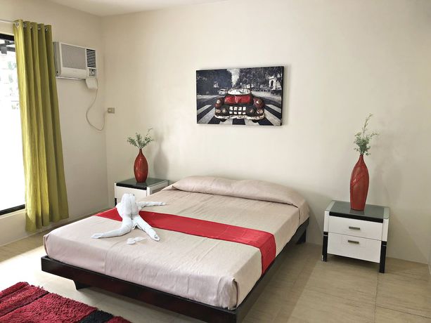 Imagen de la habitación del Hotel Quezon Premier Candelaria. Foto 3