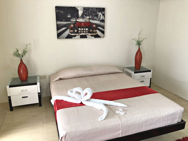 Imagen de la habitación del Hotel Quezon Premier Candelaria. Foto 4
