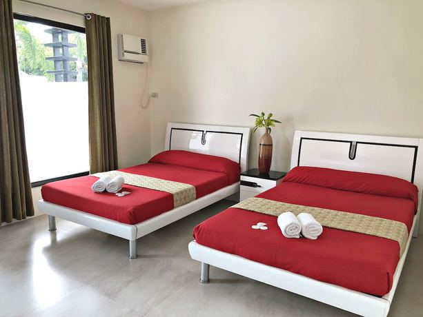 Imagen de la habitación del Hotel Quezon Premier Candelaria. Foto 7