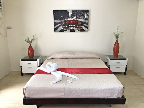 Imagen de la habitación del Hotel Quezon Premier Candelaria. Foto 10