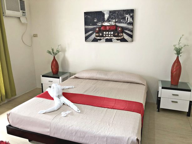 Imagen de la habitación del Hotel Quezon Premier Candelaria. Foto 13