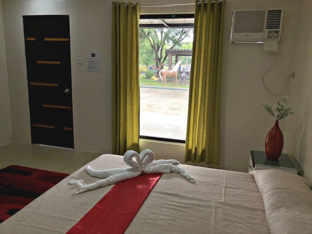 Imagen de la habitación del Hotel Quezon Premier Candelaria. Foto 14