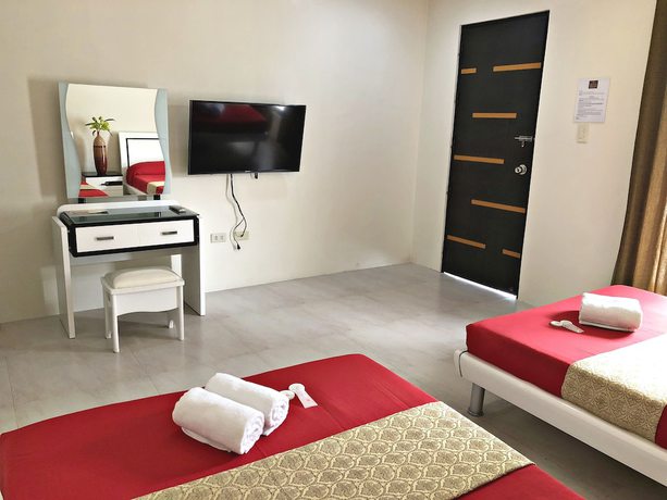 Imagen de la habitación del Hotel Quezon Premier Candelaria. Foto 15