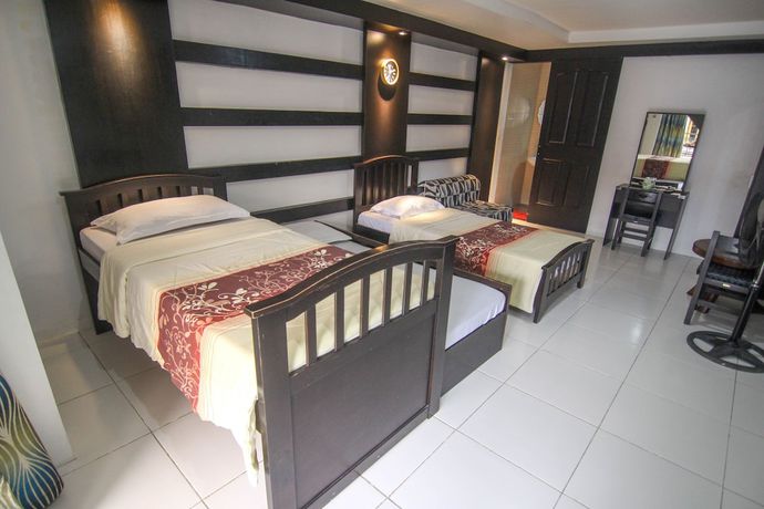 Imagen de la habitación del Hotel Quezon Premier Lucena. Foto 2