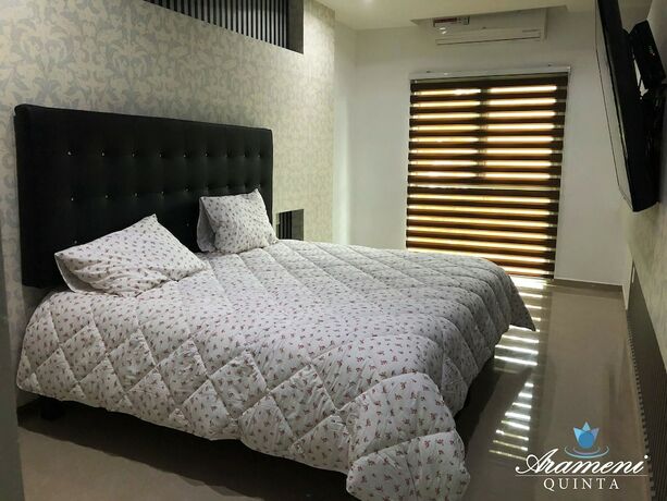 Imagen de la habitación del Hotel Quinta Arameni Suites. Foto 7