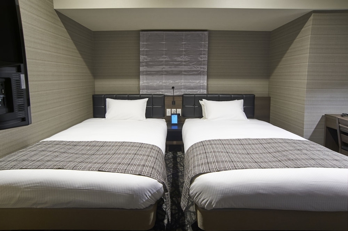 Imagen de la habitación del Hotel Quintessa Tokyo Haneda Comic & Books. Foto 8