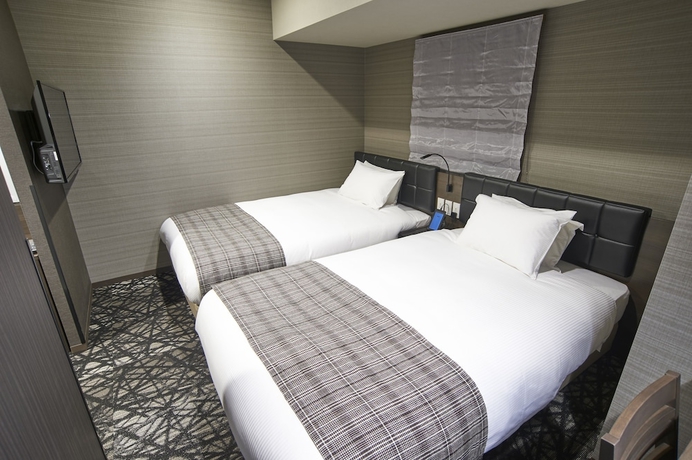 Imagen de la habitación del Hotel Quintessa Tokyo Haneda Comic & Books. Foto 12