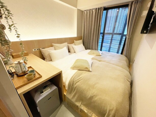 Imagen de la habitación del Hotel R Namba. Foto 12