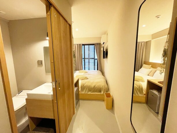 Imagen de la habitación del Hotel R Namba. Foto 16