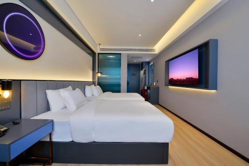 Imagen de la habitación del Hotel R Royalss, Yulin Yuxing Square. Foto 18