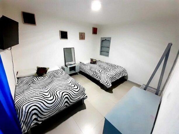 Imagen de la habitación del Hotel RCH Suite. Foto 18