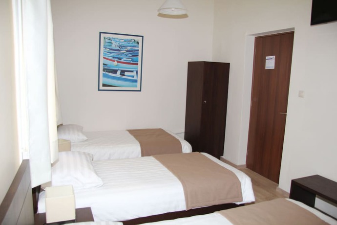 Imagen de la habitación del Hotel REA, Heraklion. Foto 3