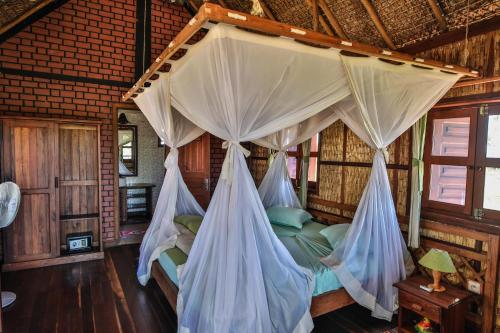 Imagen de la habitación del Hotel RELAIS DU KIRINDY. Foto 16