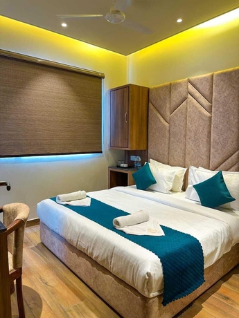 Imagen de la habitación del Hotel RK Heights. Foto 10