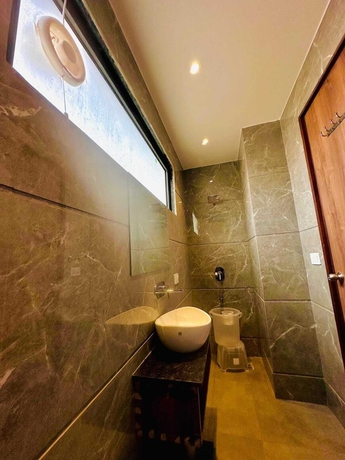 Imagen de la habitación del Hotel RK Heights. Foto 15