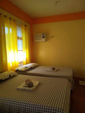 Imagen de la habitación del Hotel RMTM\'s Beachfront Accommodation. Foto 20