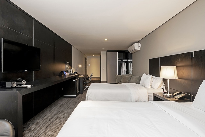 Imagen de la habitación del Hotel ROCKEFELLER by Slaviero Hotéis. Foto 16