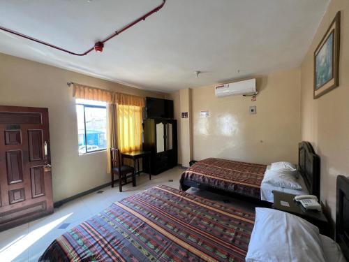 Imagen de la habitación del Hotel RODEY. Foto 14