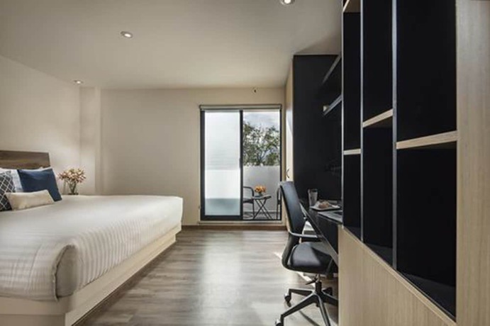 Imagen de la habitación del Hotel ROOM and Suites. Foto 13