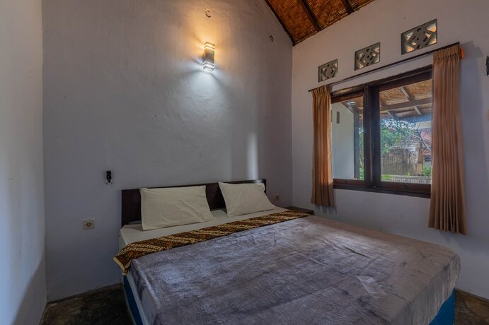 Imagen de la habitación del Hotel RR Homestay Kuta Lombok. Foto 17