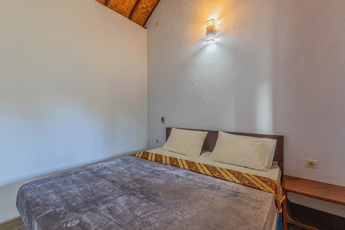 Imagen de la habitación del Hotel RR Homestay Kuta Lombok. Foto 18