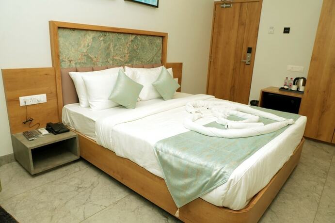 Imagen de la habitación del Hotel Radhika, Dwarka. Foto 10