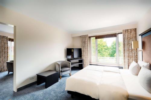 Imagen de la habitación del Hotel Radisson Blu Senator. Foto 13