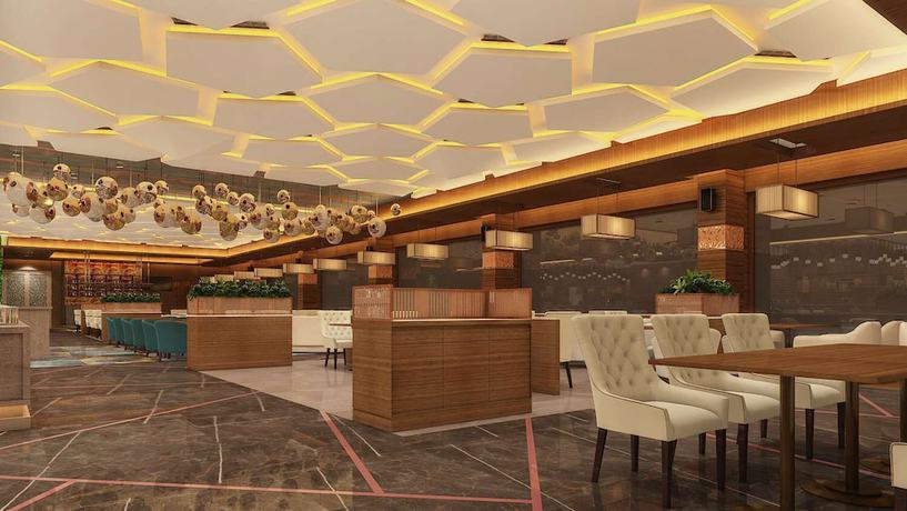 Imagen del bar/restaurante del Hotel Radisson Blu Towers Kaushambi Delhi NCR. Foto 5