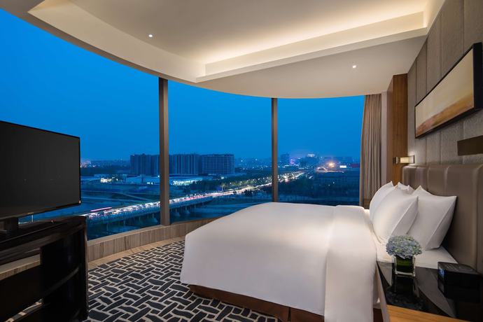 Imagen de la habitación del Hotel Radisson Blu Zhengzhou Huiji. Foto 11