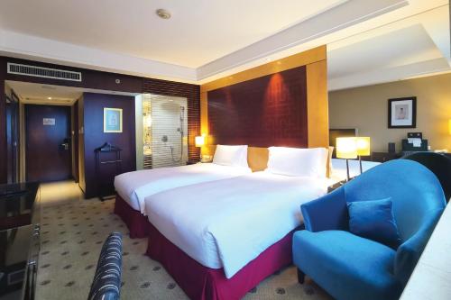 Imagen de la habitación del Hotel Radisson Collection Hyland Shanghai. Foto 17