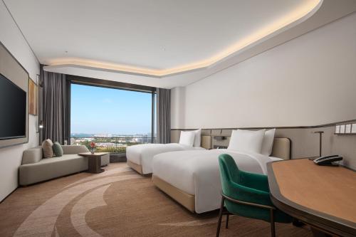 Imagen de la habitación del Hotel Radisson Collection Lingang Shanghai. Foto 10