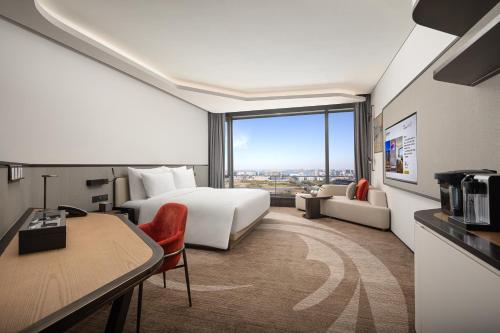 Imagen de la habitación del Hotel Radisson Collection Lingang Shanghai. Foto 18