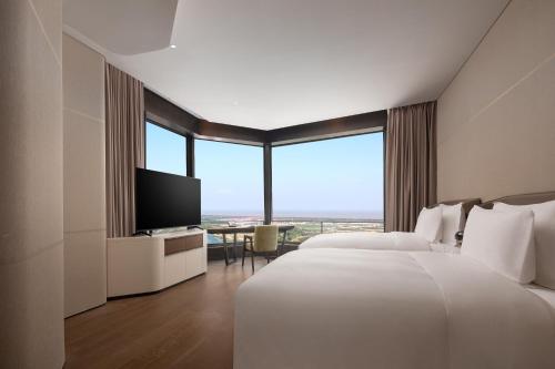 Imagen de la habitación del Hotel Radisson Collection Lingang Shanghai. Foto 20