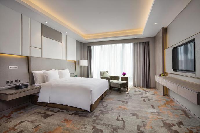 Imagen de la habitación del Hotel Radisson Exhibition Center Shanghai. Foto 11