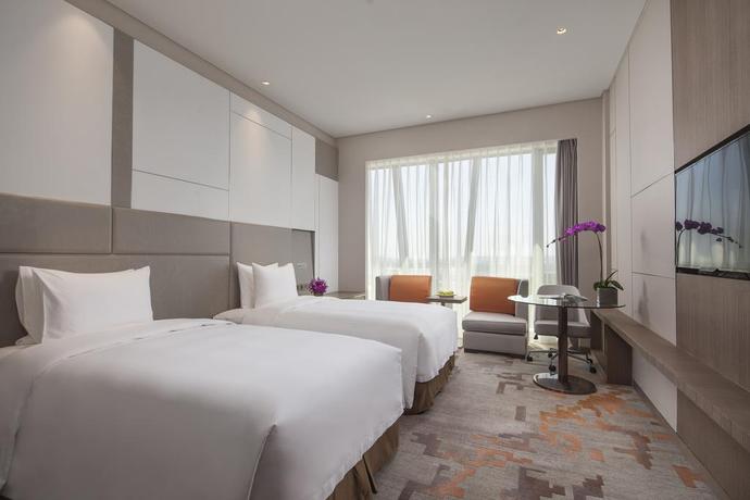 Imagen de la habitación del Hotel Radisson Exhibition Center Shanghai. Foto 15